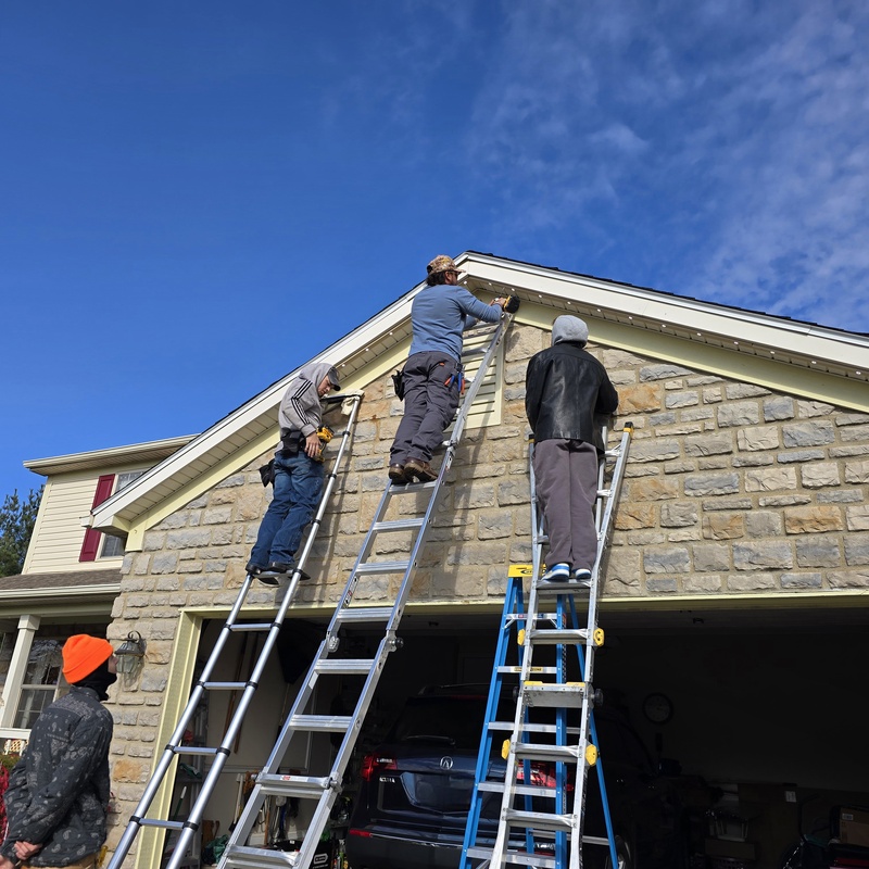 Our team hard at work climbing ladders so you don't have too.